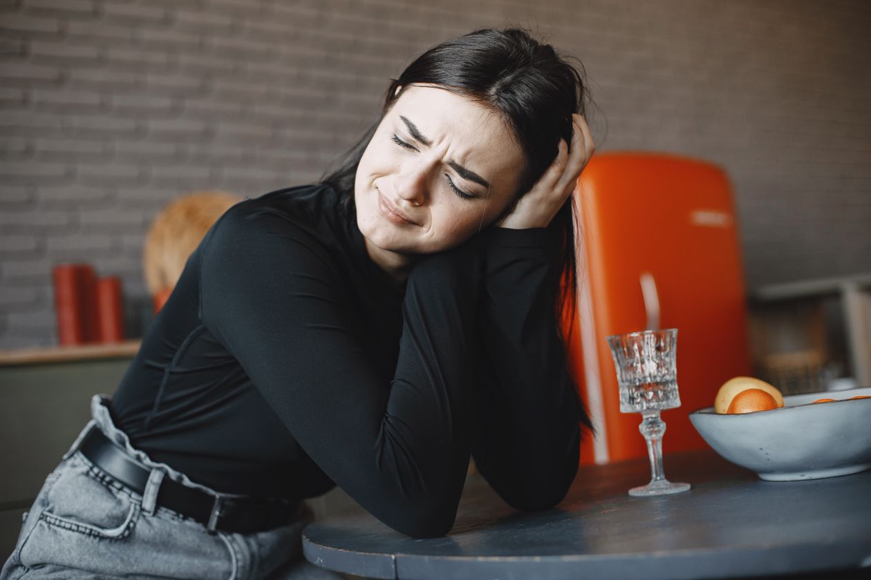 A woman showing visible emotional distress during a conversation