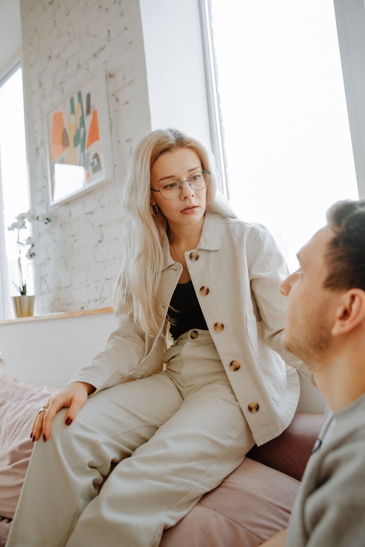 A woman having a serious, thoughtful conversation with her partner