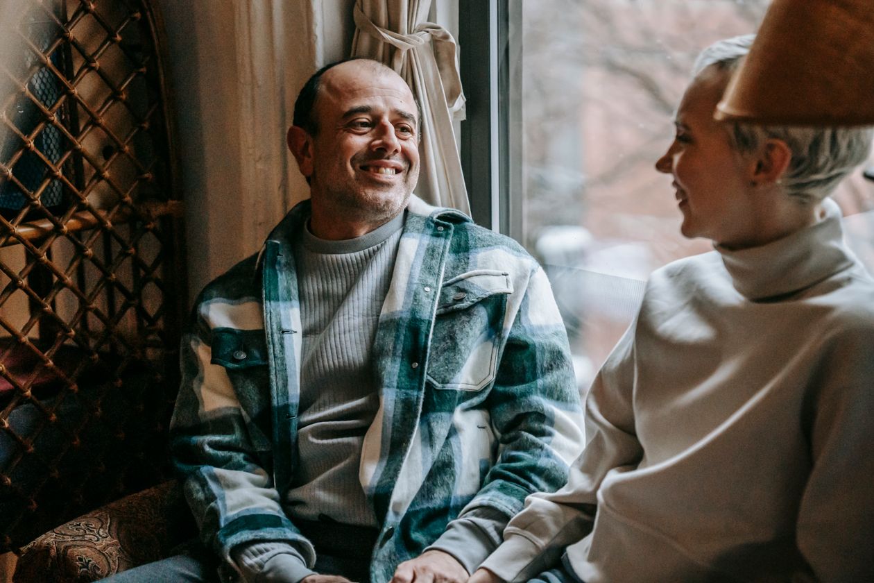 A couple having a calm, positive conversation together
